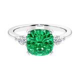Cushion shaped engagement ring with brilliant diamonds and colombian emerald.