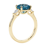 Three stone cushion diamond ring in yellow gold setting with alexandrite and diamonds.
