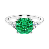 Cushion shaped engagement ring with brilliant diamonds and colombian emerald.