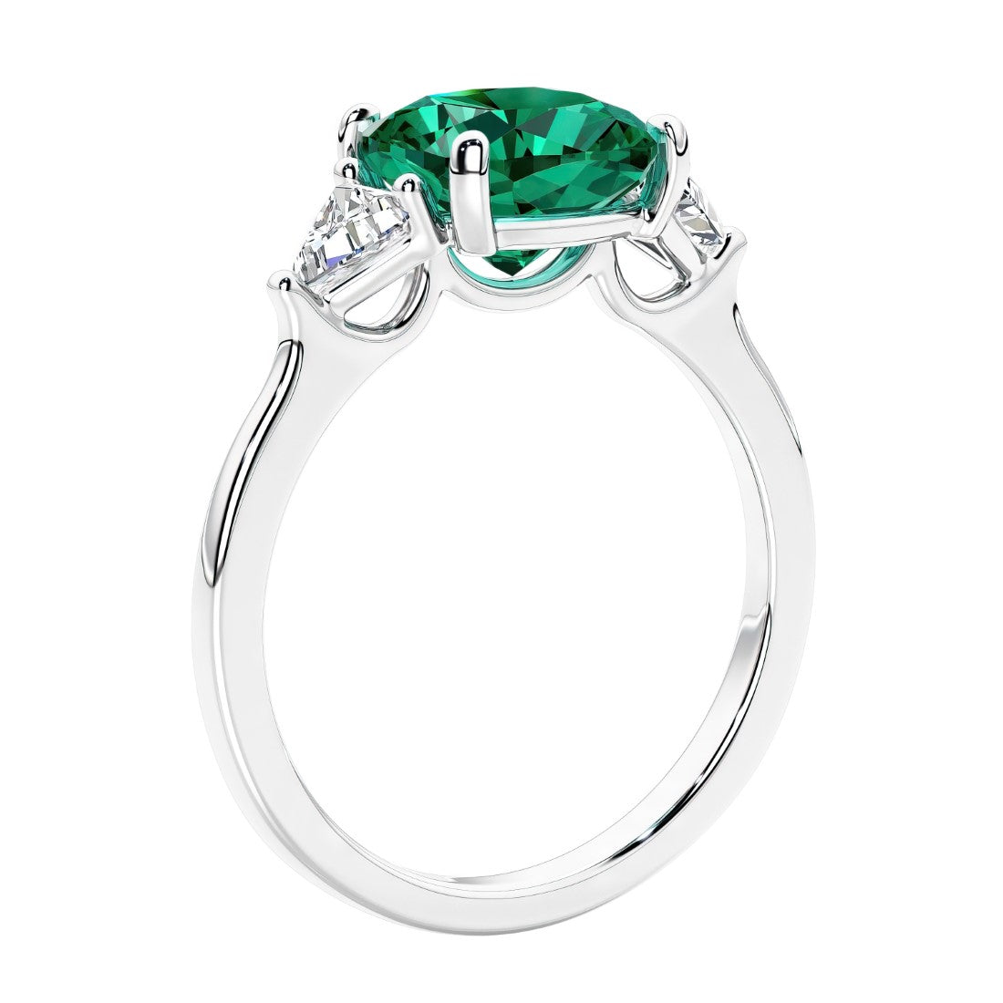 Cushion cut diamond ring as a unique engagement ring featuring three stone design with green emerald and diamonds.