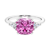 Cushion shaped engagement ring with brilliant diamonds and pink sapphire.