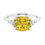 Cushion shaped engagement ring with brilliant diamonds and yellow sapphire.