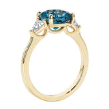 Three stone cushion diamond ring in yellow gold setting with alexandrite and diamonds.