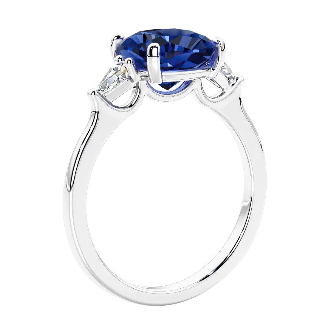 Cushion cut diamond ring as a unique engagement ring featuring three stone design with blue gemstone and diamonds.