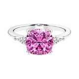Cushion shaped engagement ring with brilliant diamonds and pink gemstone.