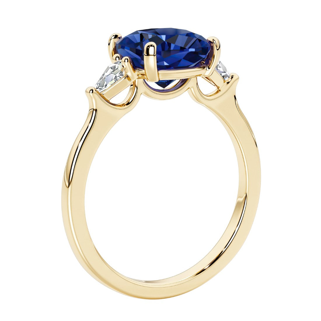 Three stone cushion diamond ring in yellow gold setting with blue gemstone and diamonds.