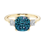 Cushion cut 3 stone engagement ring with soft corners and vintage charm.