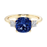 Cushion cut 3 stone engagement ring with soft corners and vintage charm.