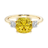 Cushion cut 3 stone engagement ring with soft corners and vintage charm.