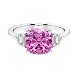 Cushion shaped engagement ring with brilliant diamonds and pink gemstone.