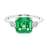 Asscher gemstone diamond ring with step-cut sparkle in a three stone setting.