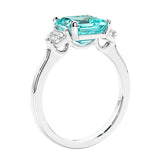 Asscher shaped ring in a timeless three stone ring set with diamond sides and paraiba tourmaline center.
