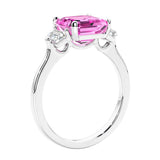 Asscher shaped ring in a timeless three stone ring set with diamond sides and pink sapphire center.