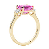 3 stone Asscher cut gemstone diamond ring in a classic Art Deco style featuring a pink sapphire center.