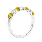 Anniversary diamond ring featuring 7 lab created diamonds and gemstones in a classic band.