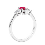 Marquise shaped engagement ring with diamonds in classic 3 stone ring setting.