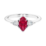 Three stone marquise diamond ring with dramatic center shape.