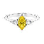 Three stone marquise diamond ring with dramatic center shape.