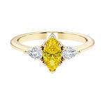 Marquise cut 3 stone engagement ring with elegant taper.