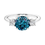 Timeless three stone round diamond engagement ring.