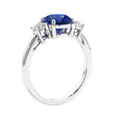 3 stone wedding ring featuring round center diamond and matching sides.