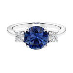 Timeless three stone round diamond engagement ring.