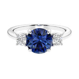 Timeless three stone round diamond engagement ring.