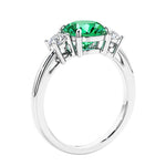 3 stone wedding ring featuring round center diamond and matching sides.
