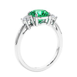 3 stone wedding ring featuring round center diamond and matching sides.