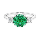 Timeless three stone round diamond engagement ring.