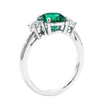 3 stone wedding ring featuring round center diamond and matching sides.