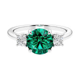 Timeless three stone round diamond engagement ring.