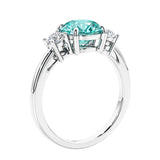 3 stone wedding ring featuring round center diamond and matching sides.