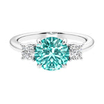 Timeless three stone round diamond engagement ring.