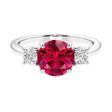 Timeless three stone round diamond engagement ring.
