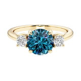Three stone round engagement ring with brilliant cut diamonds.