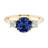 Three stone round engagement ring with brilliant cut diamonds.
