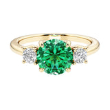 Three stone round engagement ring with brilliant cut diamonds.