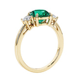 3 stone round diamond ring in classic yellow gold setting.