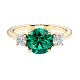 Three stone round engagement ring with brilliant cut diamonds.