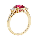 3 stone round diamond ring in classic yellow gold setting.