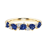 9-stone gemstone anniversary band featuring pear-cut blue sapphires and round diamonds for a magical, color-shifting effect.