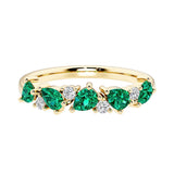 9-stone gemstone anniversary band featuring pear-cut green emeralds and round diamonds for a magical, color-shifting effect.