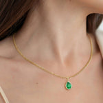 Woman wearing Pear Emerald Solitaire Pendant Necklace 14x10mm 8 Carat in 14K Gold with Cable Curb Chain