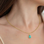 Woman wearing Pear Paraiba Tourmaline Necklace Solitaire Pendant 14x10mm 8 Carat in 14K Gold with Cable Curb Chain