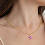 Woman wearing Pear Pink Sapphire Solitaire Pendant Necklace 14x10mm 8 Carat in 14K Gold with Cable Curb Chain