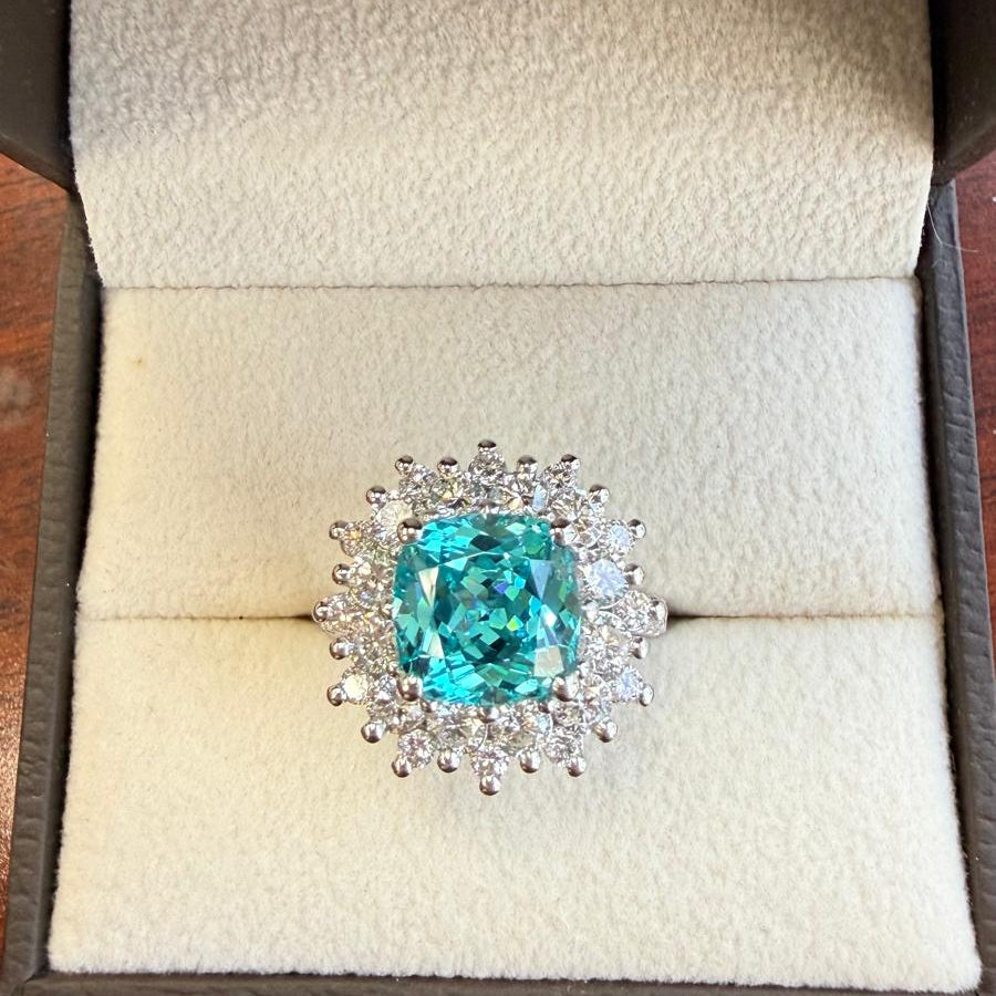 Luxury and heirloom inspired custom made jewelry featuring lab neon green paraiba tourmaline and diamonds a client saw at a Sotheby's auction