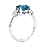 3 stone wedding ring featuring round alexandrite center diamond and matching sides.