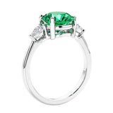3 stone wedding ring featuring round colombian emerald center diamond and matching sides set in 14k white gold.