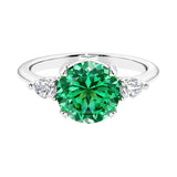 3 stone colombian emerald and diamond engagement ring with round center, symbolizing past, present, and future, set in 14k white gold.